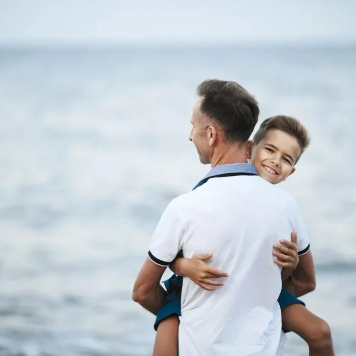 dad-is-holding-son-scaled